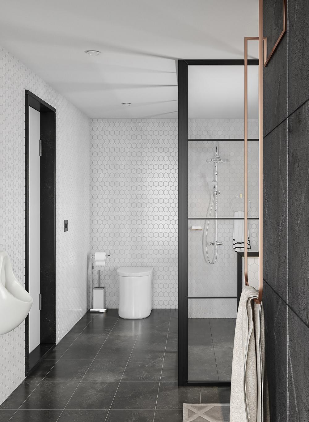 Góc chụp khác của phòng tắm, với sàn lát đá đen, tường ốp gạch họa tiết tổ ong màu trắng sàn phòng tắm lát đá