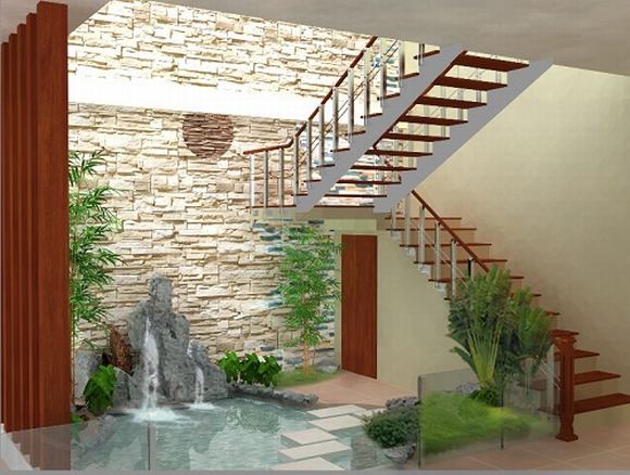 Trong ảnh là tiểu cảnh có đá và thác nước chảy, đặt cạnh cầu thang gỗ thiết kế tiểu cảnh đẹp