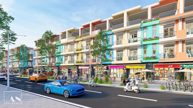 A street with cars and buildings along itDescription automatically generated with medium confidence
